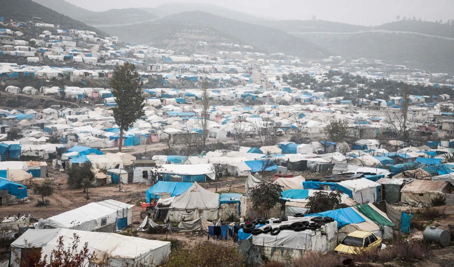 In this file photo taken on December 12, 2019 shows a view of tents at a camp for displaced Syrians at Khirbet al-Joz in the west of the northwestern Idlib province near the border with Turkey, where residents survive mostly on aid and barely have enough money to buy food and clothes to keep warm. (AFP)