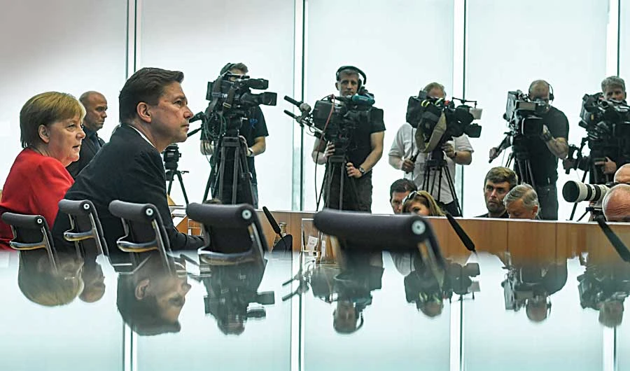 German government spokesman Steffen Seibert attends the summer press conference in Berlin. (AFP)