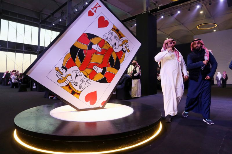 Saudi men at the "Baloot" card-playing competition, as Saudi women join a local Baloot tournament for the first time, in Riyadh, Saudi Arabia. (Reuters)