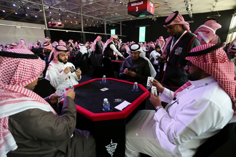 Saudi men play the popular card game "Baloot", as Saudi women join a local Baloot tournament for the first time, in Riyadh, Saudi Arabia. (Reuters)