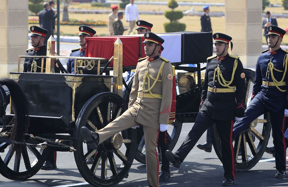 Egyptian honor guards escort the coffin of former president Hosni Mubarak during his funeral ceremony at Cairo's Mosheer Tantawi mosque. (AFP)