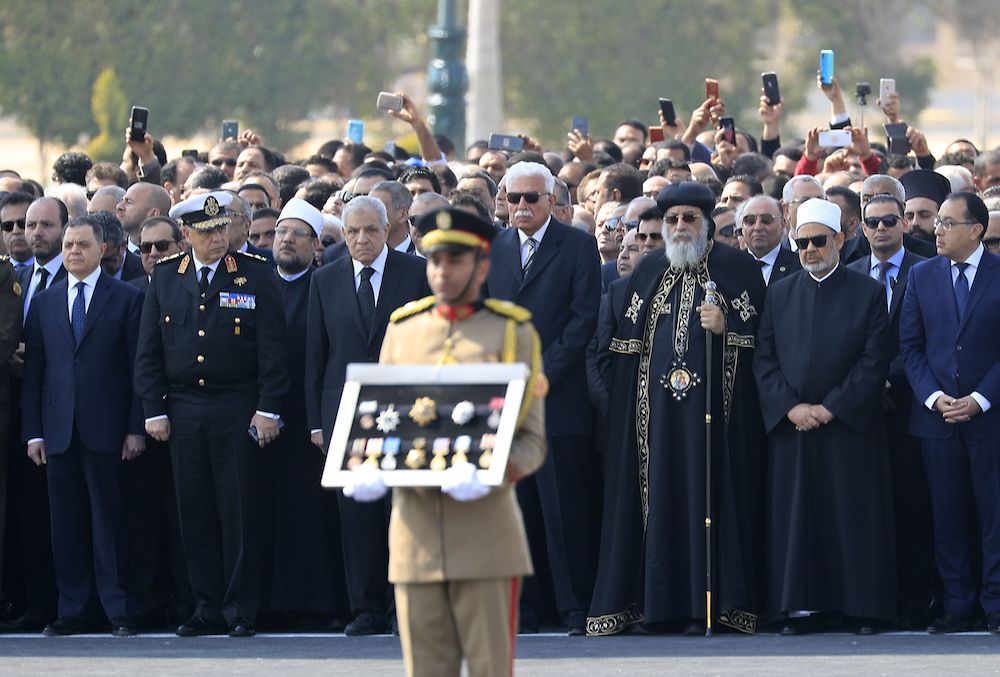 Grand Imam of Al-Azhar Ahmed Al-Tayeb (2nd R) and Egypt's Pope Tawadros II (3rd R), the Coptic Orthodox Patriarch of Alexandria on the Holy See of Saint Mark and Palestinian Foreign Minister Riyad Al-Maliki (4th R), stand among other Arab officials during the funeral ceremony of Egypt's former president Hosni Mubarak. (AFP)