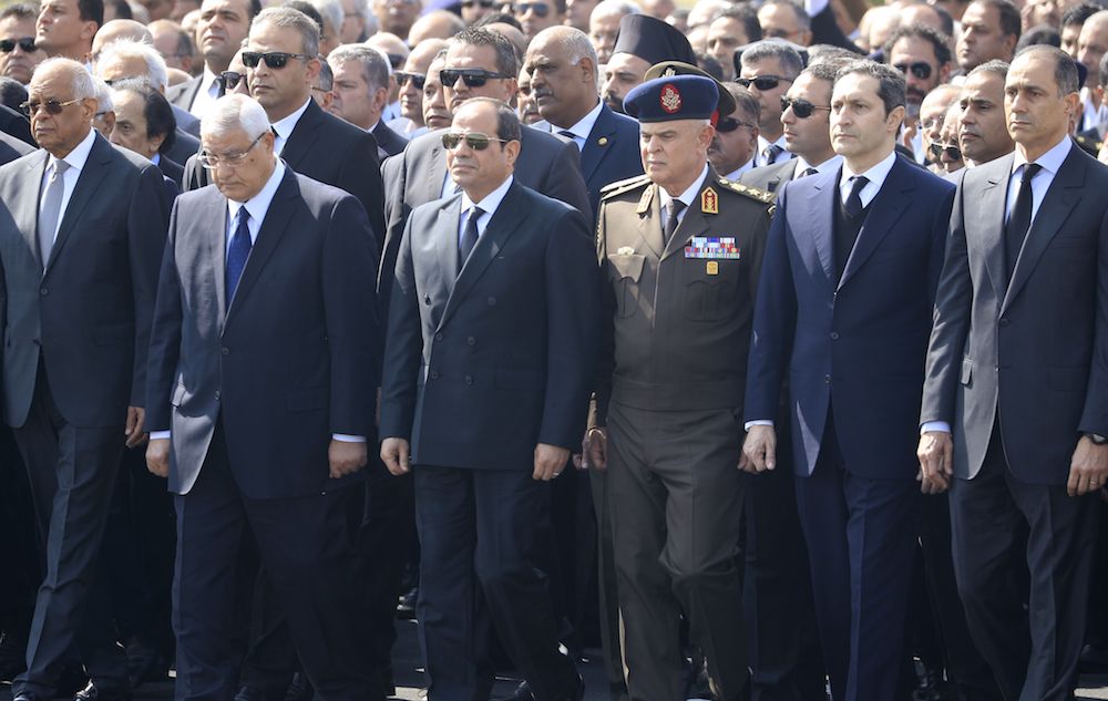 Egyptian President Abdel Fattah El-Sisi (C), former interim president Adly Mansur (2nd L) and the sons of of Egypt's former president Hosni Mubarak, Alaa (2nd R) and Gamal (R), attend Mubarak's funeral. (AFP)