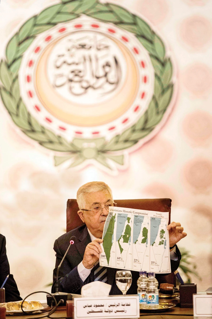 Palestinian President Mahmoud Abbas shows the Arab League meeting maps of, from left, historical Palestine, the 1947 UN partition plan, the 1948-1967 borders between the Palestinian territories and Israel, and the proposed plan for the territories without Israeli-annexed areas and settlements. (AFP)