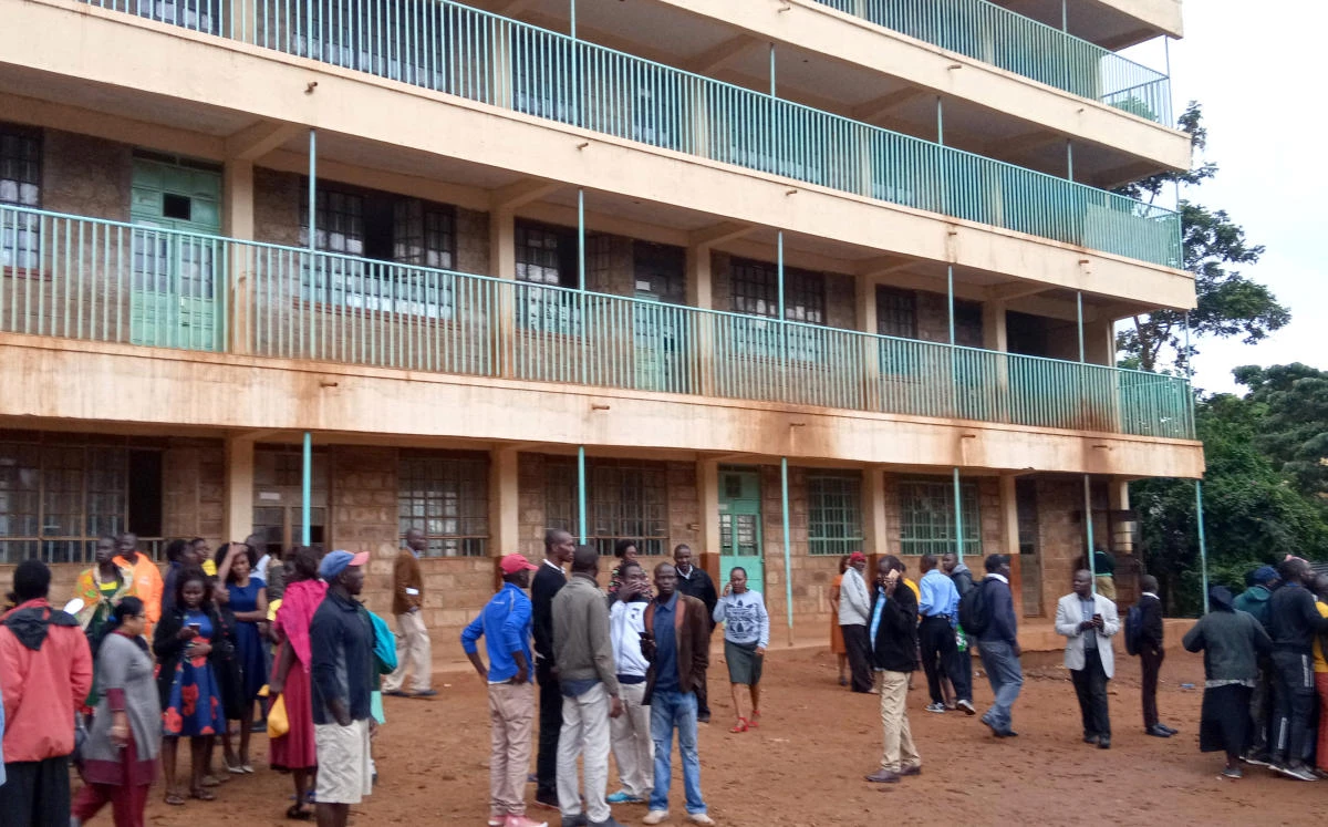 Parents and teachers gather near the scene of a stampede at Kakamega primary school in Kakamega, Kenya. (Reuters)