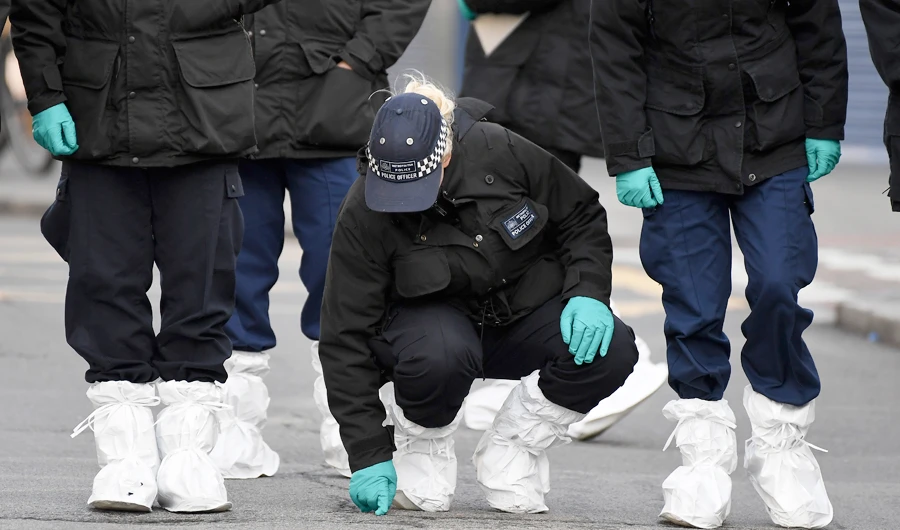 Police officers work at the scene of Sunday's terror stabbing attack in the Streatham area of south London Monday Feb. 3, 2020. (AP)