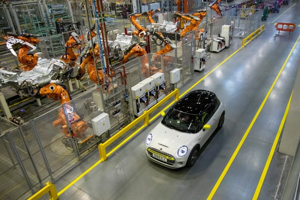 Britain’s pledge to reduce greenhouse gas emissions to net zero by 2050 gives carmakers such like BMW in their electric cars such as the MINI, above, which is being produced in Cowley, near Oxford. (AFP)