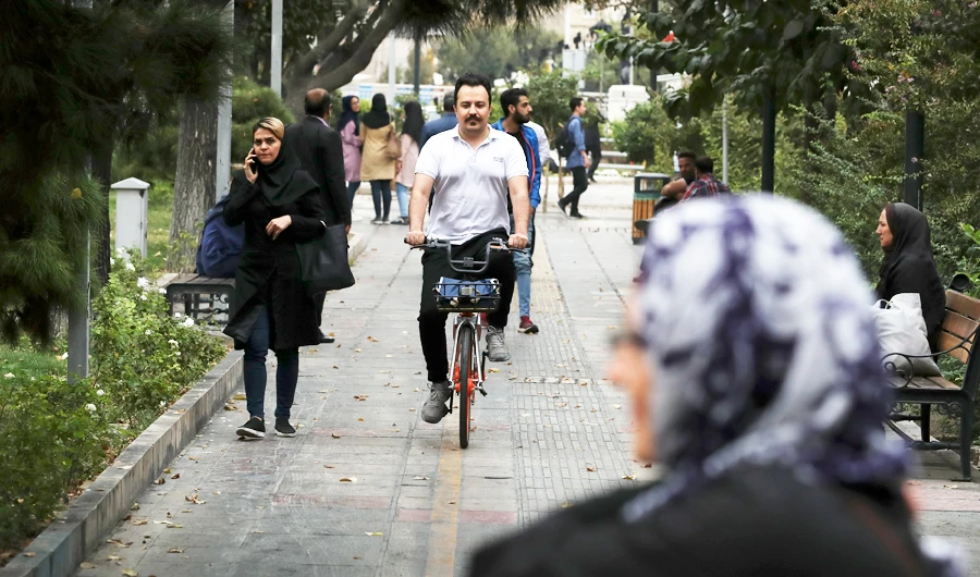 In this Sunday, Oct. 20, 2019, Tehran resident Hossein Ranjbar rides a bicycle rented from GPS-enabled bicycles station with his smartphone in Tehran, Iran. (AP)