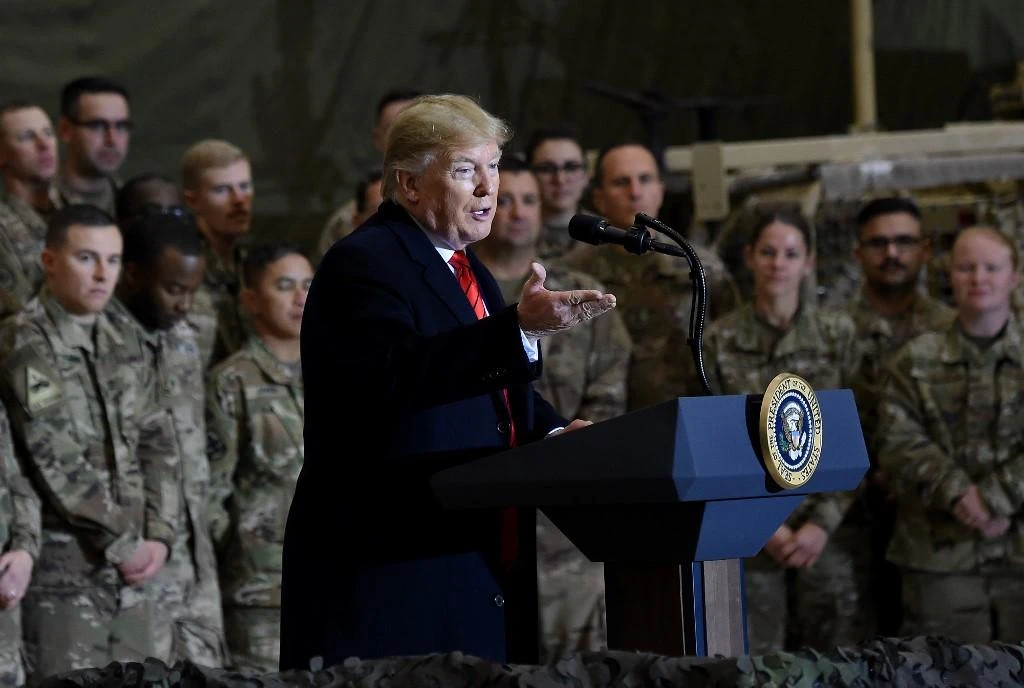 US President Donald Trump has long questioned the wisdom of keeping troops overseas and has described the war in Afghanistan as a drain on blood and treasure. Above, Trump during a surprise Thanksgiving Day visit at Bagram Air Field, on November 28, 2019. (AFP)
