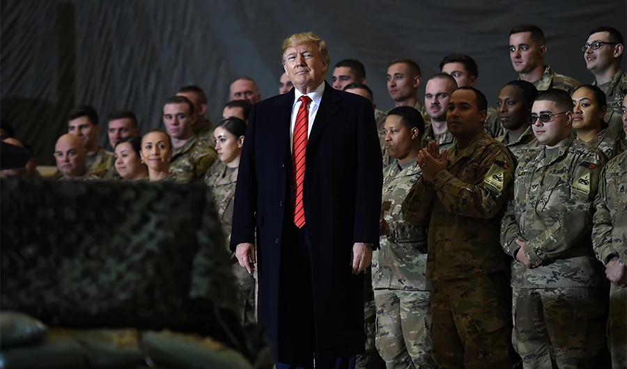 US President Donald Trump speaks to the troops during a surprise Thanksgiving day visit at Bagram Air Field, on November 28, 2019 in Afghanistan. (AFP)