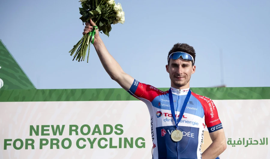 Italy’s Niccolo Bonifazio of Total Direct Energie celebrates on the podium after winning the Saudi Tour second stage. (AFP)