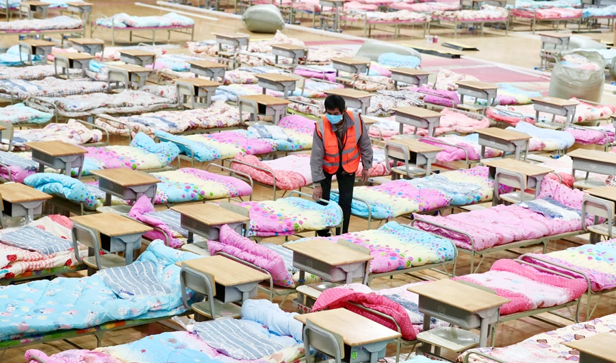 A worker sets up beds at the Hongshan Stadium to convert it into a makeshift hospital following an outbreak of the new coronavirus, in Wuhan, Hubei province, China February 4, 2020. (REUTERS)