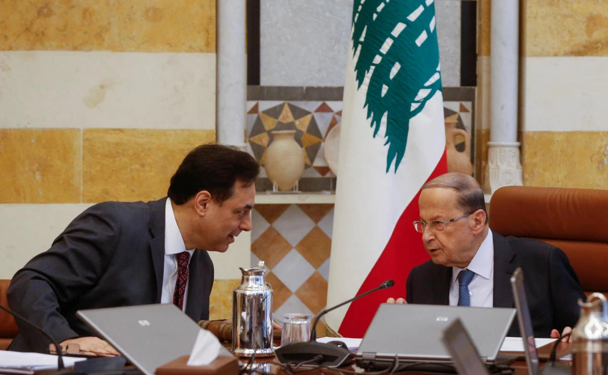 Lebanon's Prime Minister Hassan Diab speaks with Lebanon's President Michel Aoun during a cabinet meeting at the presidential palace in Baabda, Lebanon February 6, 2020. (Reuters)