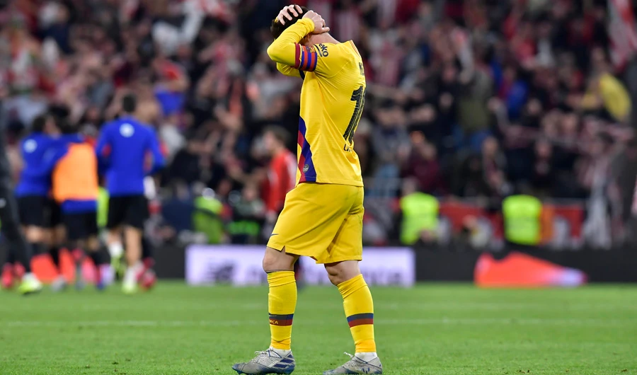 Barcelona's Lionel Messi walks in dejection at the end of the Spanish Copa del Rey quarter final soccer match between Athletic Bilbao and Barcelona at San Mames stadium in Bilbao, Spain, on Feb. 6, 2020. (AP Photo/Alvaro Barrientos)