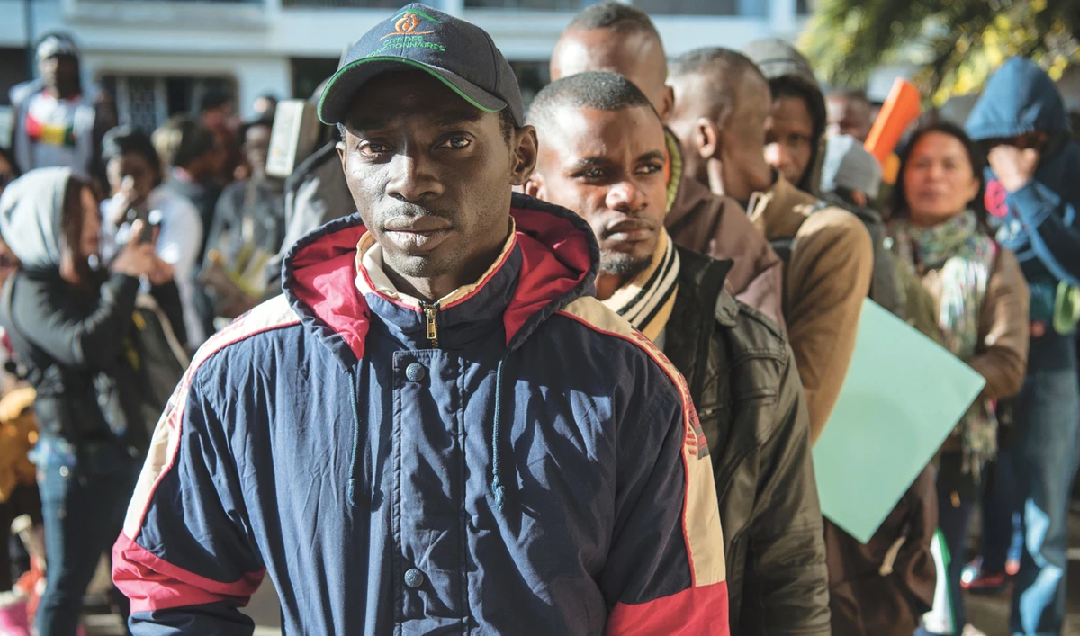 Migrants in queue during a drive to regularize illegal migrants living in Morocco. (AFP)