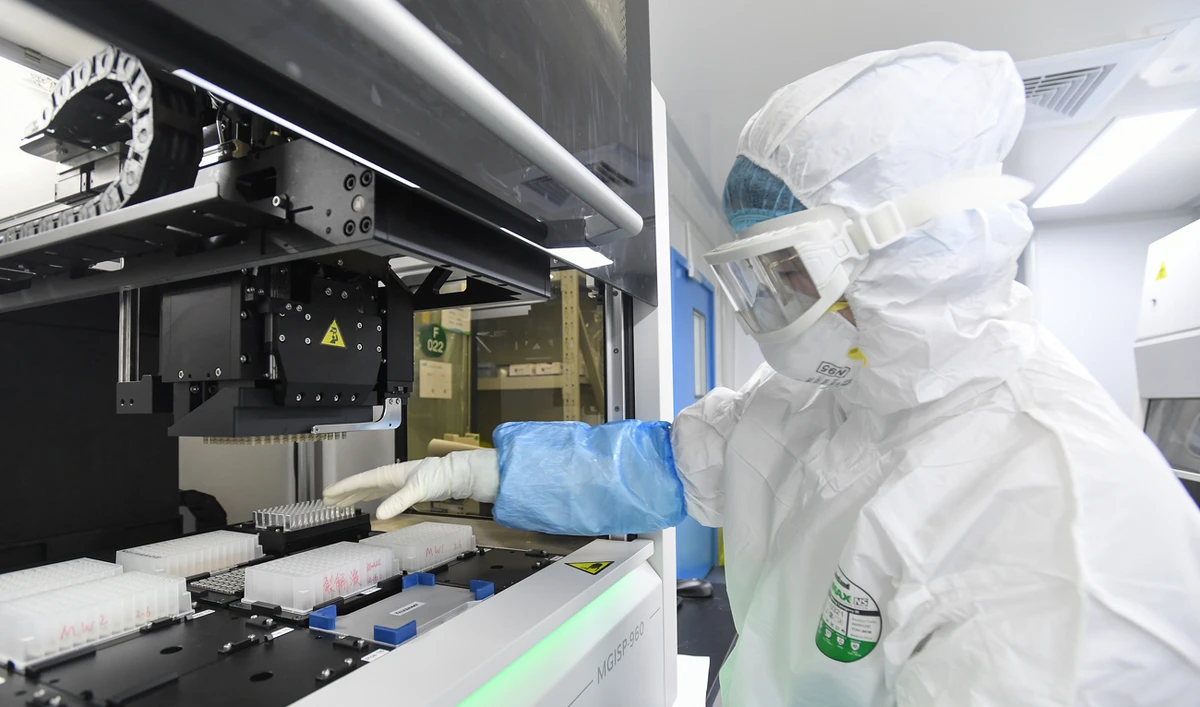 a laboratory technician working on samples from people to be tested for the new coronavirus at "Fire Eye" laboratory in Wuhan in China's central Hubei province. (AFP)