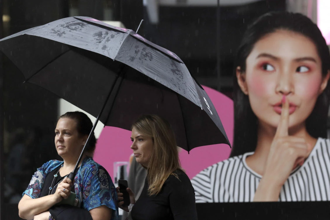 Torrential rain lashing Australia on Sunday extinguished a major wildfire and caused widespread flash flooding. (AP)