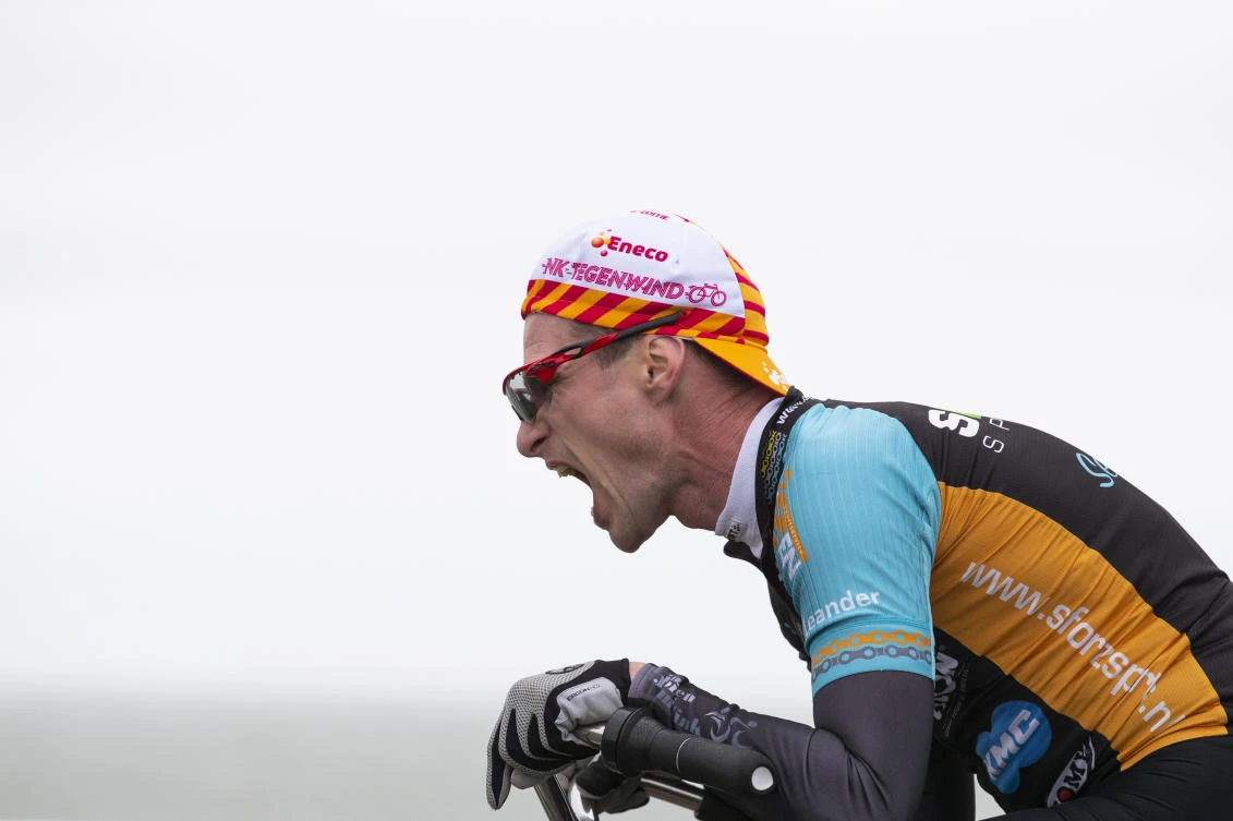 A competitor battles gale force winds during the Dutch Headwind Cycling Championships on the storm barrier Oosterscheldekering near Neeltje Jans, south-western Netherlands, Sunday, Feb. 9, 2020. (AP)