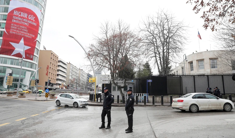 A banner emblazoned with the Turkish flag hangs on a building across from the U.S. embassy, right, and reads: "No force can block our struggle against terrorism," in Ankara, Turkey, Monday, March 5, 2018. (AP)
