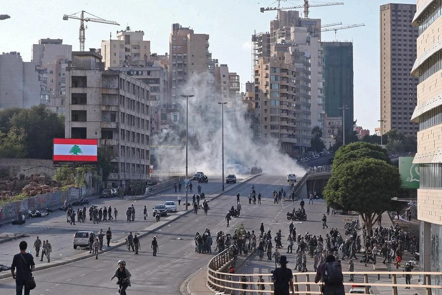 Lebanese government wins confidence vote as protesters clash with police outside parliament