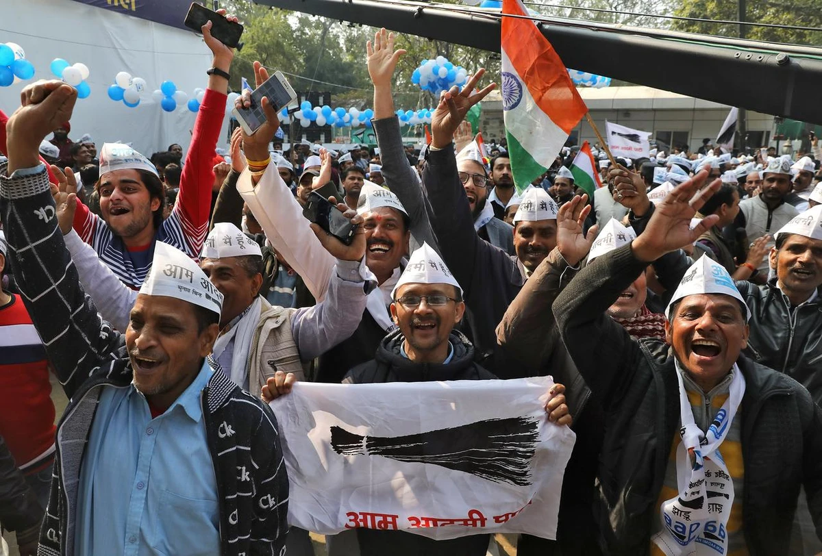 Supporters of Aam Aadmi Party (AAP) celebrate after learning of the initial poll results outside its party headquarters in New Delhi, India, February 11, 2020. (Reuters)