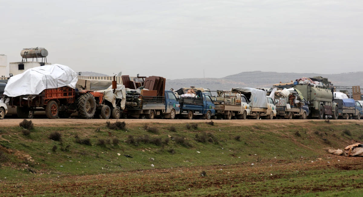 A general view of vehicles carrying belongings of internally displaced Syrians from western Aleppo countryside, in Hazano near Idlib, Syria, February 11, 2020. (Reuters)