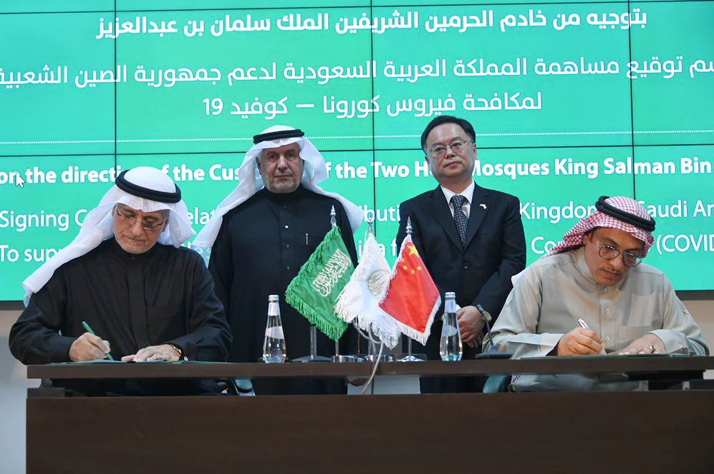 Dr Abdullah Al-Rabeeah, the supervisor general of KSRelief, and Chinese Ambassador Chen Weiqing stand during the contracts signing ceremony. (Supplied)