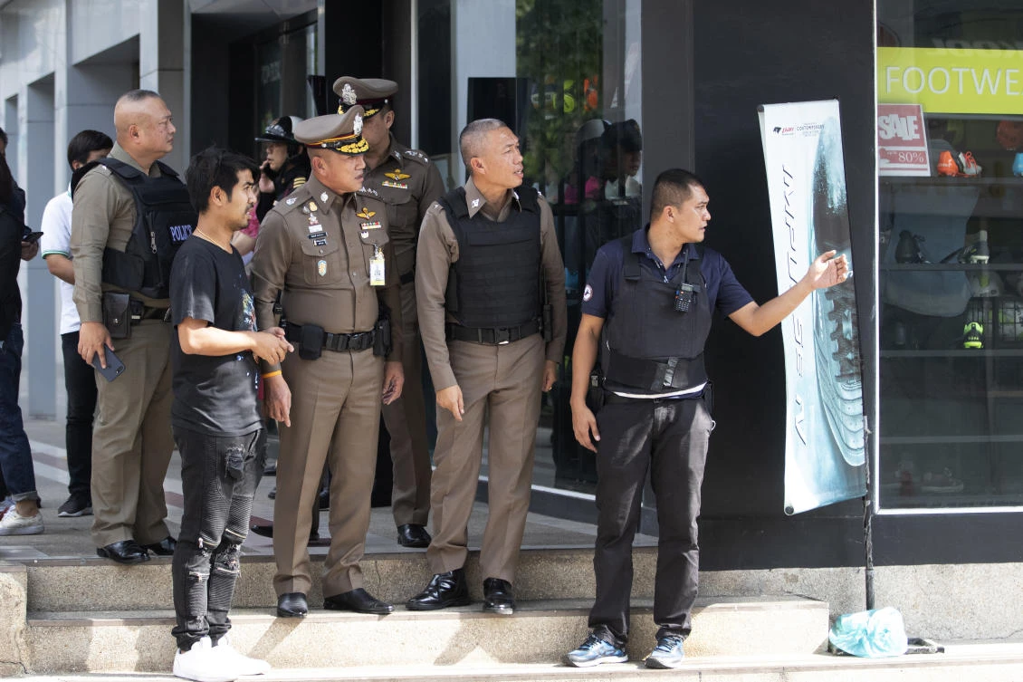 Thai police officers gather near the site of a shooting in Bangkok, Thailand, Friday, Feb. 14, 2020. Multiple gunshots have been fired into the air by a man in the middle of the capital Bangkok, police said. (AP)