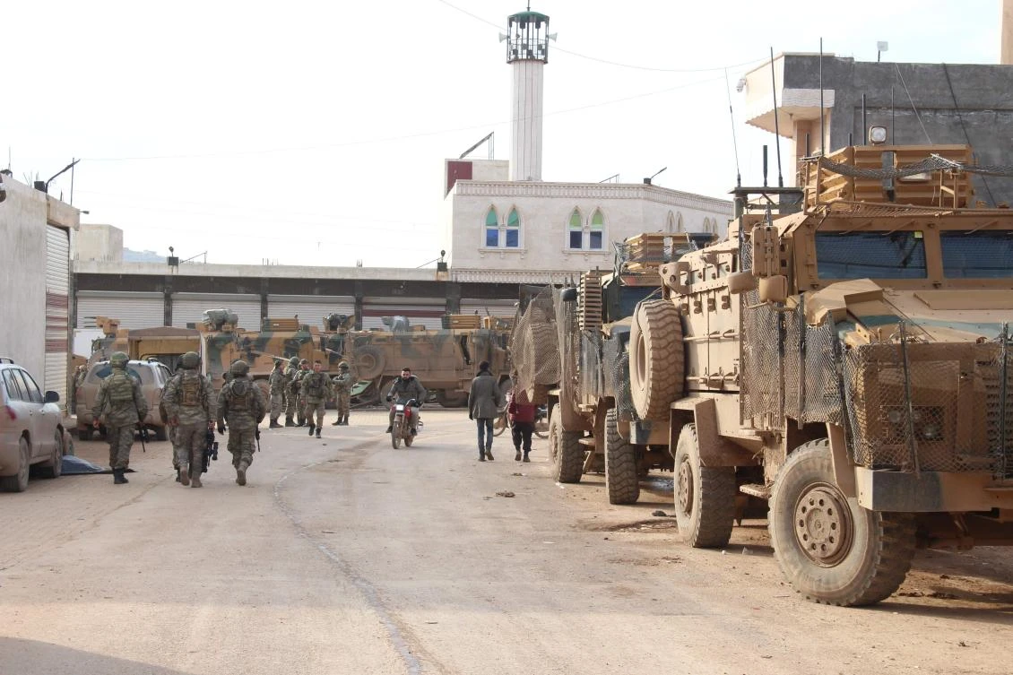 A picture taken on February 16, 2020, shows a convoy of the Turkish army in the commercial area of the Syrian town of Sarmada in the northwestern province of Idlib. The situation in Syria has become more tense as pro-regime forces intensify their assault on the last major rebel bastion of Idlib, where Turkey has 12 observation posts as part of a 2018 Ankara-Moscow agreement, four of which are surrounded by regime forces according to Turkish officials. (AFP)