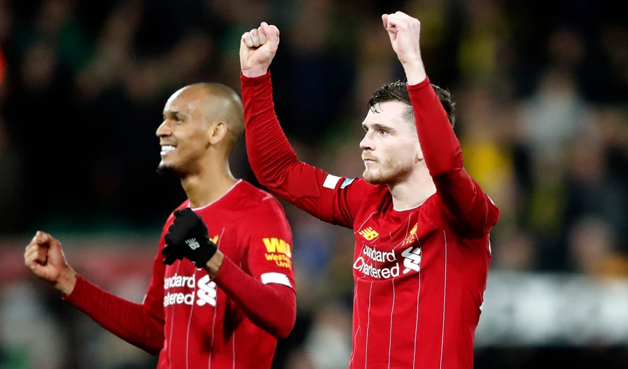 Liverpool players celebrate their victory over Norwich City on Saturday. (AP)