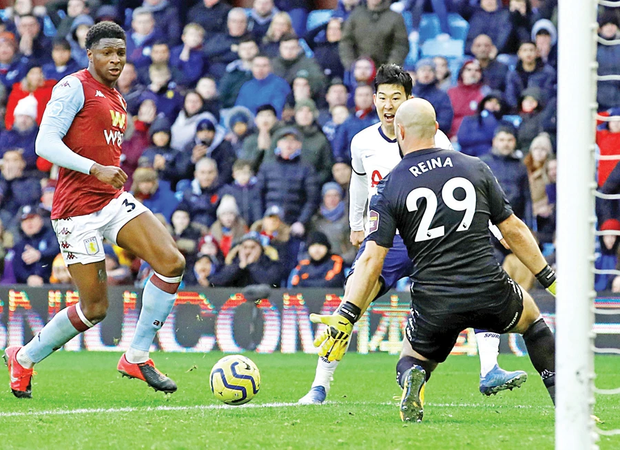 Son Heung-min scores a goal during the English Premier League match between Aston Villa and Tottenham Hotspur in Birmingham on Sunday. (Reuters)