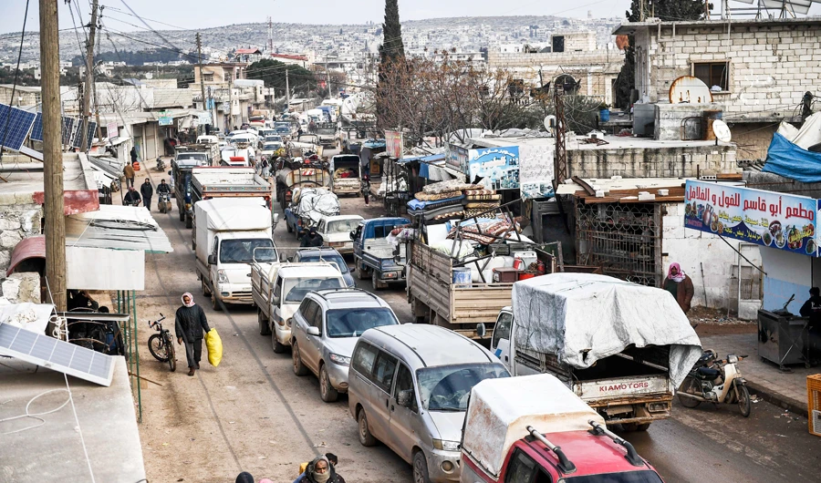 Civilians flee from Idlib toward the north to find safety inside Syria near the border with Turkey, Saturday, Feb. 15, 2020. Syrian troops are waging an offensive in the last rebel stronghold. (AP Photo)