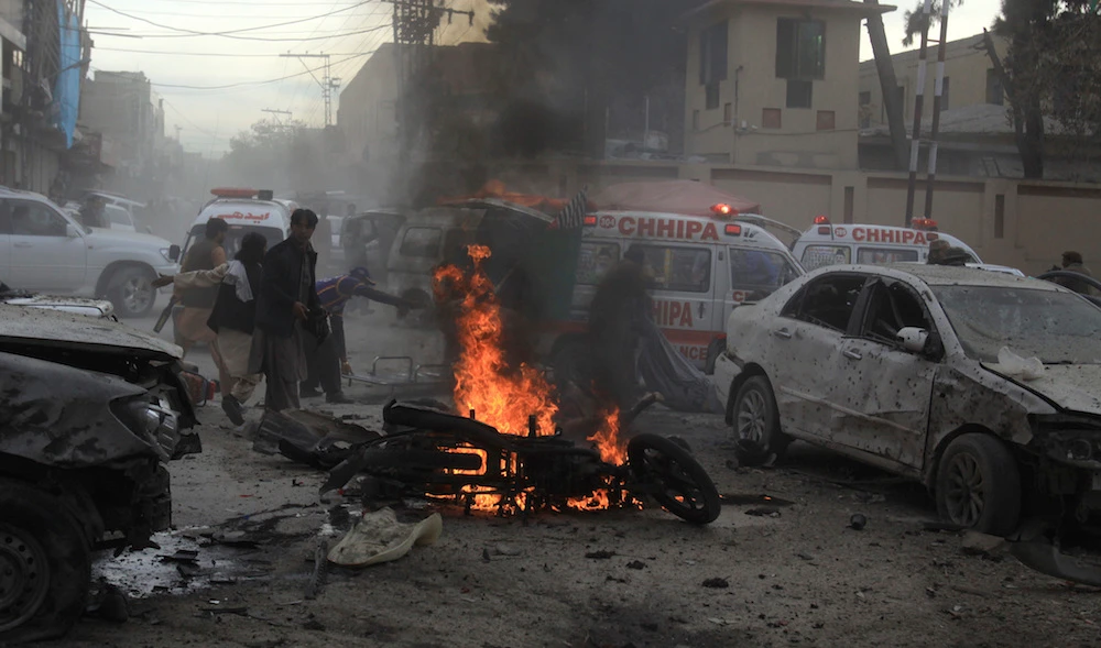 Pakistani rescue workers and volunteers help to remove victims at the site of a suicide bombing in Quetta, Pakistan, Monday, Feb. 17, 2020. (AP)