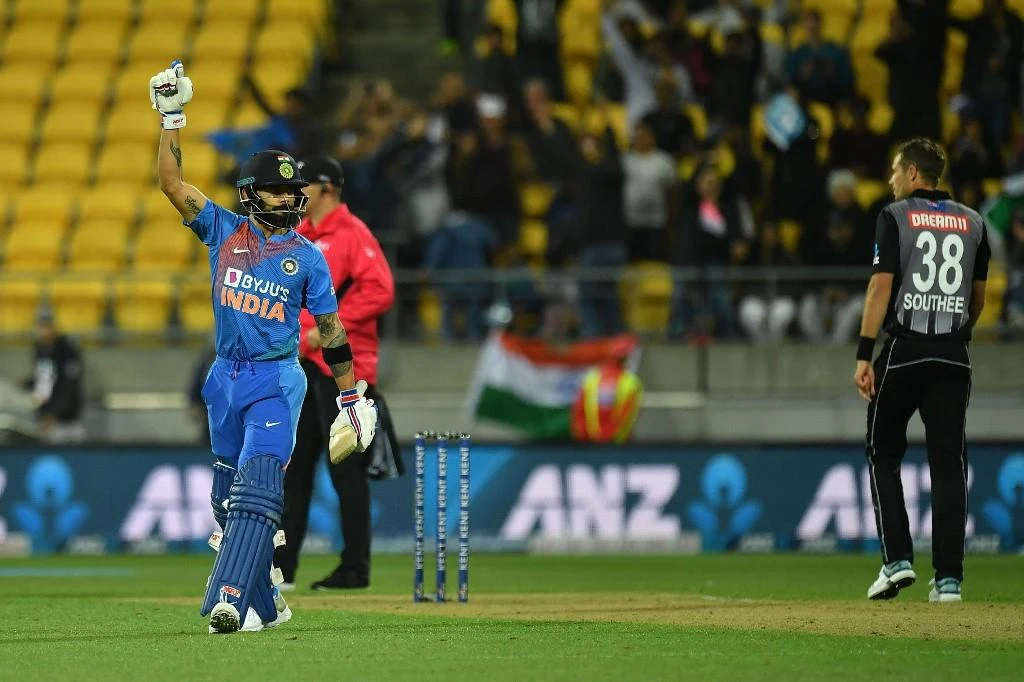 India’s captain Virat Kohli, left, celebrate their win during the fourth Twenty20 international cricket match between New Zealand and India at Sky Stadium in Wellington on January 31, 2020. (AFP)