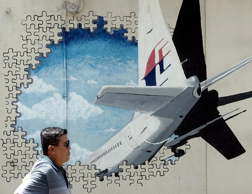 Malaysia suspected MH370 downed in murder-suicide: former Australian PM