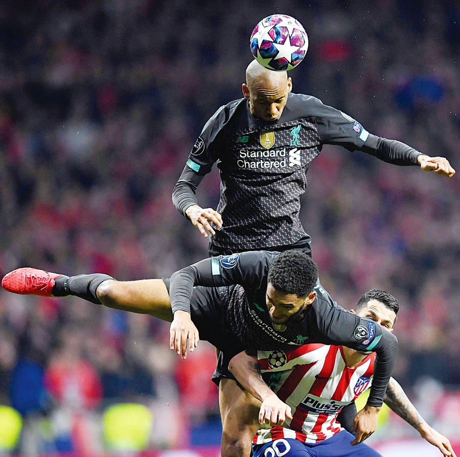 Liverpool’s Brazilian midfielder Fabinho heads the ball during the match on Tuesday. (AFP)