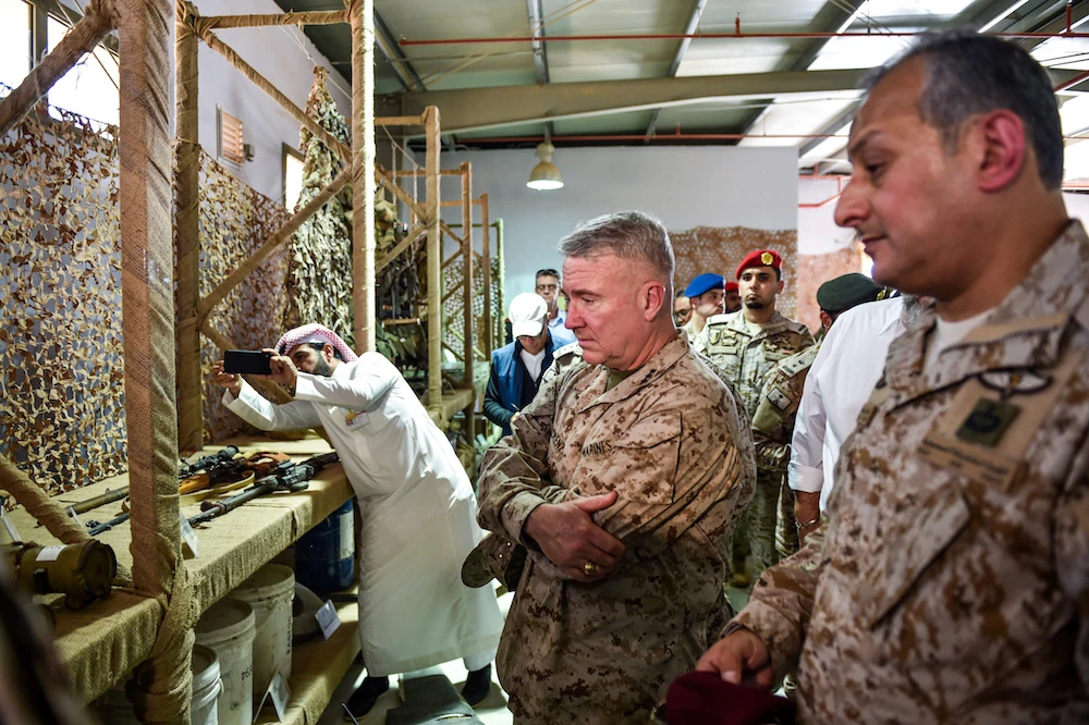 US Marine Corps General Kenneth F. McKenzie Jr. (C), commander of the US Central Command (CENTCOM) and Lt. Gen. Fahd bin Turki bin Abdulaziz Al-Saud (R), commander of the Arab coalition forces in Yemen, are shown reportedly Iranian weapons seized by Saudi forces from Yemen’s Houthi militia, during his visit to a military base in Al-Kharj in central Saudi Arabia. (File/AFP)