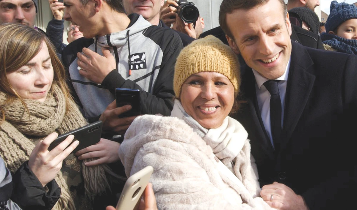 French President Emmanuel Macron meets with Muslim women during his visit to Bourtzwiller, a quarter of the eastern city of Mulhouse, France. (Reuters/File)
