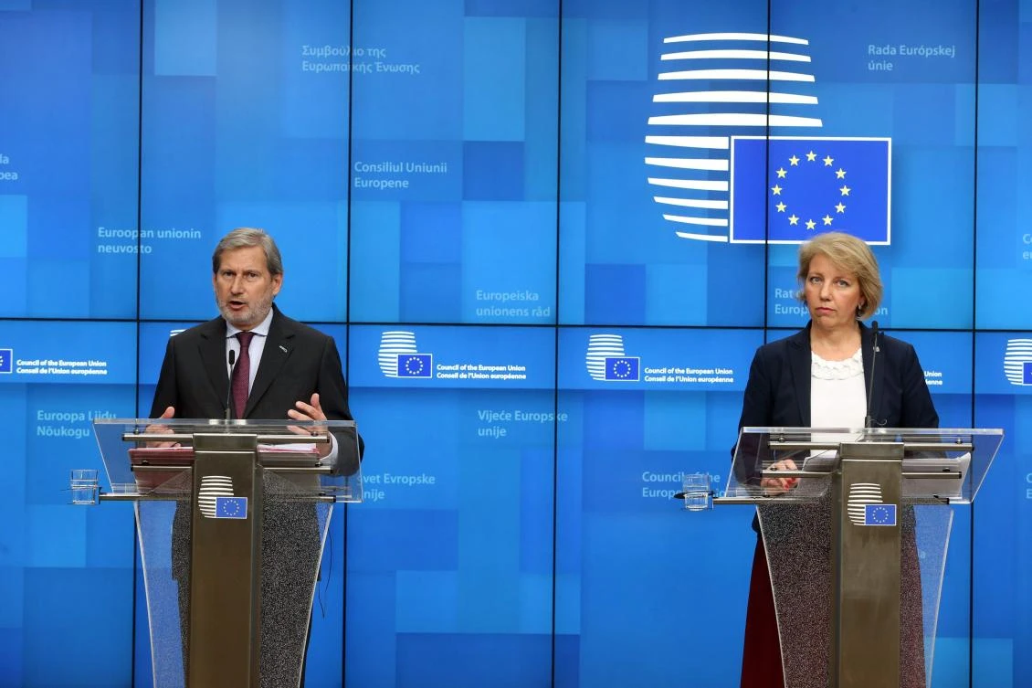 EU commissioner for Budget and Administration Johannes Hahn (L) and Croatian State Secretary for European Affairs of Croatia Andreja Metelko Zgombic give a press conference following a General Affairs Council meeting at the EU headquarters in Brussels on February 17, 2020. / AFP / François WALSCHAERTS
