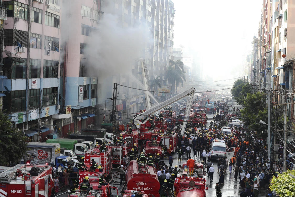 Firefighters attempt to put out fire at a market building during a fire at China town Thursday, Feb. 20, 2020, in Yangon, Myanmar. Firefighters contained a blaze in the 12-story building in the country's biggest city. (AP)