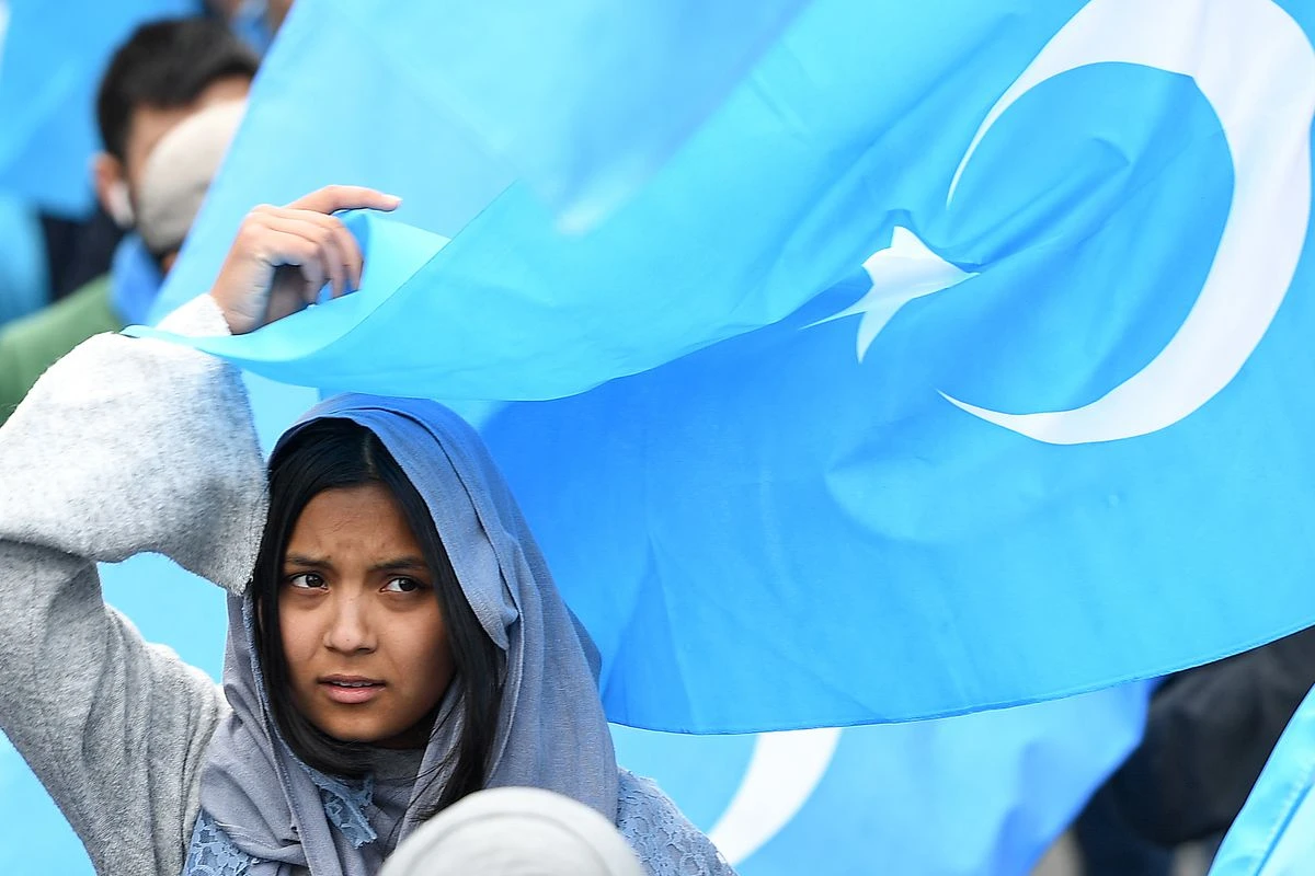 A woman takes part in a pro-Uighur rally in Brussels, the de facto capital of the European Union, Belgium. (AFP)