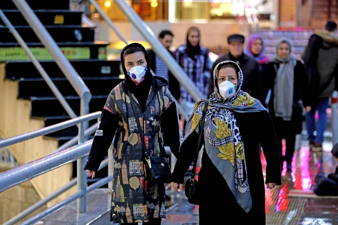 Iranian women wearing protective masks walk in a street in the capital Tehran on February 20,2020. (File/AFP)
