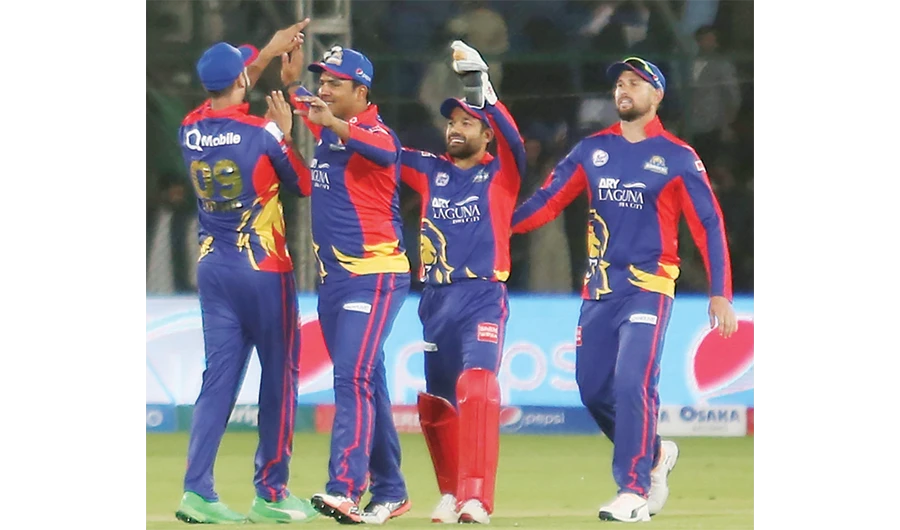 Karachi Kings players celebrate their victory against Peshawar Zalmi in Friday’s Pakistan Super League match. (AP)