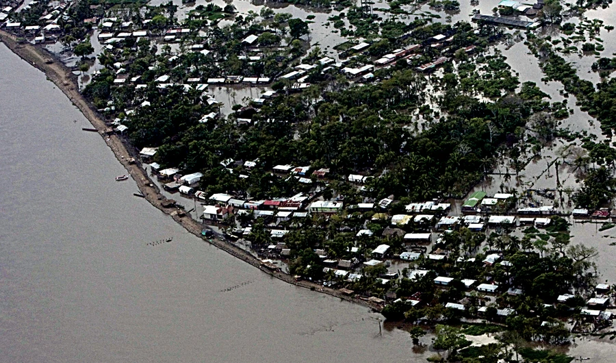 The Magdalena river floods after heavy rains in Colombia hit poor farming communities across the north of the country, causing billions of dollars in damage. (AFP)