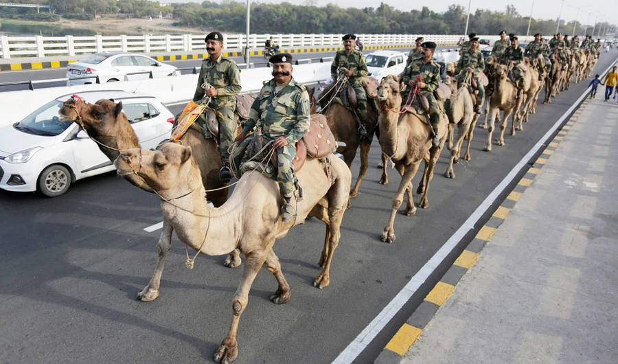 Border Security Force soldiers march on the route that US President Donald Trump will take in Ahmedabad during his India visit. (AP)