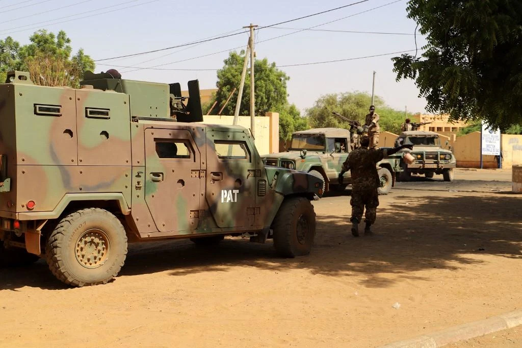 Three Mali soldiers were killed Sunday in a suspected militant attack on an outpost in the far north of the country. Above, soldiers at a security checkpoint. (AFP file photo)