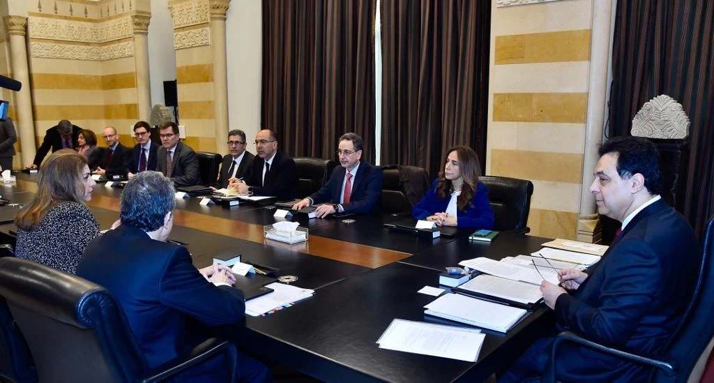 Prime Minister Hassan Diab, right, meets with a delegation from the International Monetary Fund in this February 19, 2020 picture provided by the Lebanese photo agency Dalati and Nohra. (Dalati and Nohra/AFP)