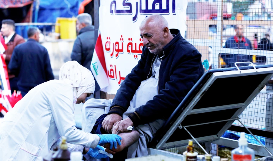 Hannaa Jassem, 24, works as a nurse in a hospital in Iraq’s capital during the week, and volunteers at its main protest site at weekends. (File/Reuters)
