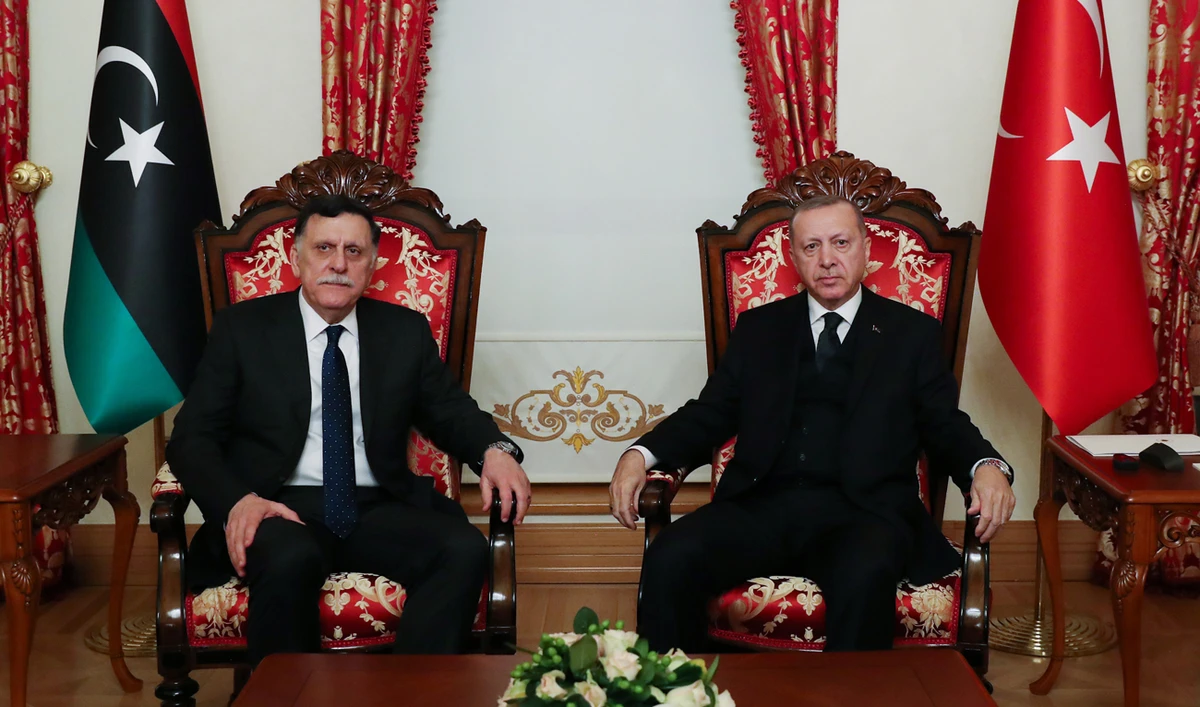 President Recep Tayyip Erdogan with head of Libya's Government of National Accord (GNA) Fayez Al-Sarraj. Erdogan announced several Turkish soldiers had been killed in the north African country. (AFP)