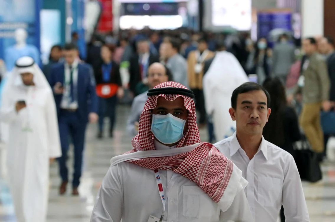 A vistor wears a mask during the Arab Health Exhibition in Dubai, UAE in January. Gulf countries announced new measures on Tuesday to cut links with Iran to prevent coronavirus spreading. (Reuters/File photo)